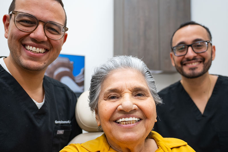 Patient and doctor smiling in mirror