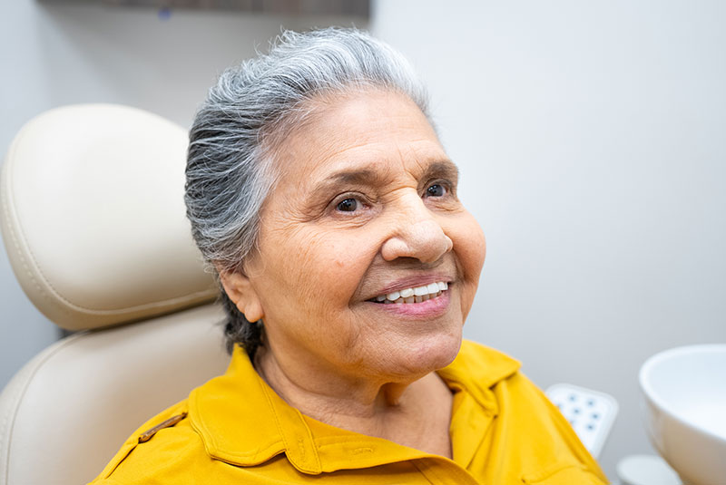 Patient Smiling after dental implant procedure