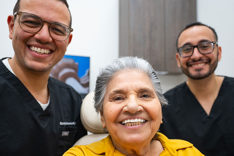 Patient and doctors smiling