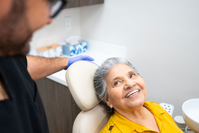 Patient looking up at doctor smiling