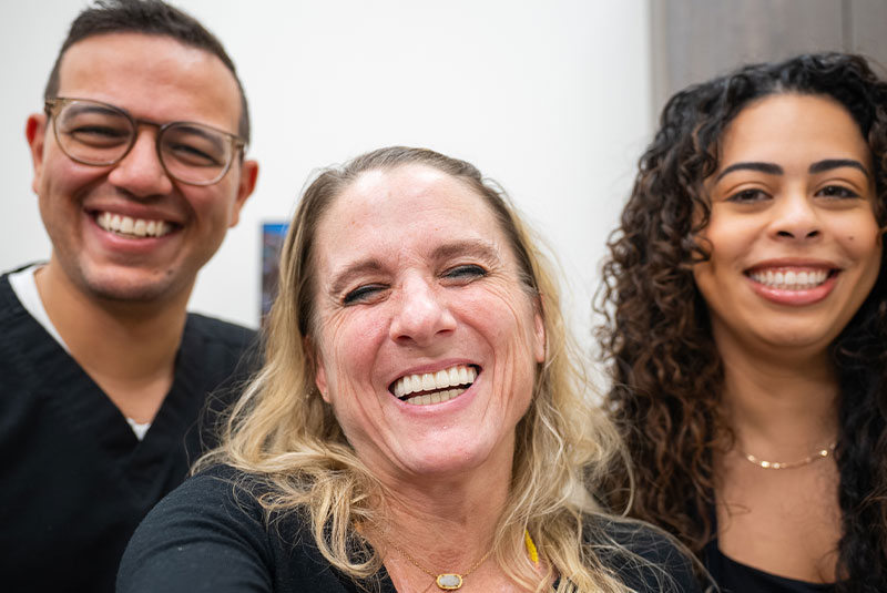 Patient and doctors smiling