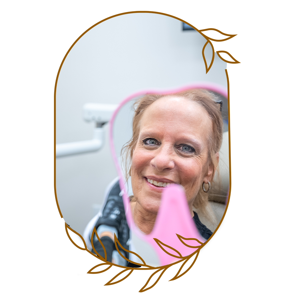 Patient Smiling into mirror